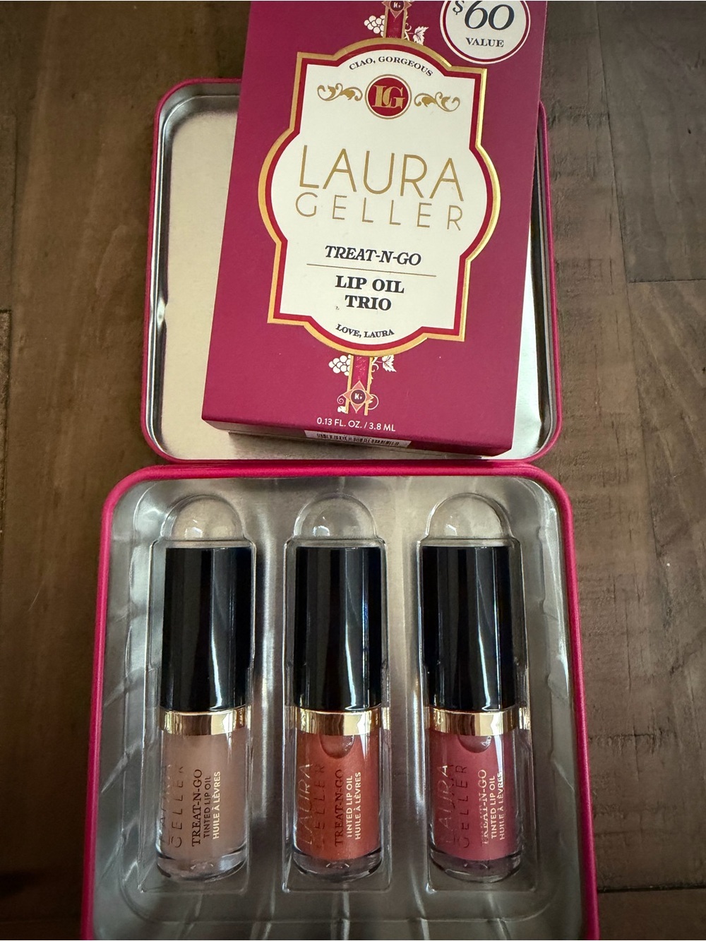 Laura Geller Treat-N-Go Lip Oil Trio featuring 3 shades of hydrating lip gloss